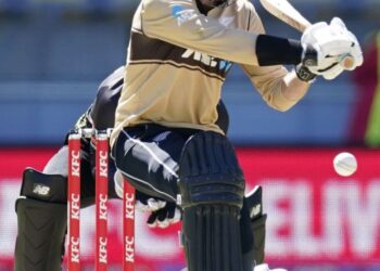 New Zealand's Devon Conway bats against Australia during their 5th T20 cricket international match at Wellington Regional Stadium in Wellington, New Zealand, Sunday, March 7 , 2021. (John Cowpland/Photosport via AP)