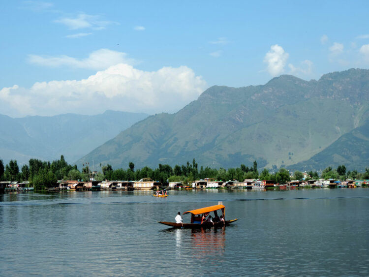 SRINAGAR, AUG 25 (UNI) Tourists enjoying Shikara ride at world famous Dal lake in Srinagar on Wednesday. UNI SRN PHOTO 3.