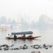 Srinagar, November 13 (UNI) A boatman rows his boat despite a dense fog in Srinagar on Saturday as the summer capital recorded seasons coldest night with 0.1 minimum temperature. UNI PHOTO SRN5