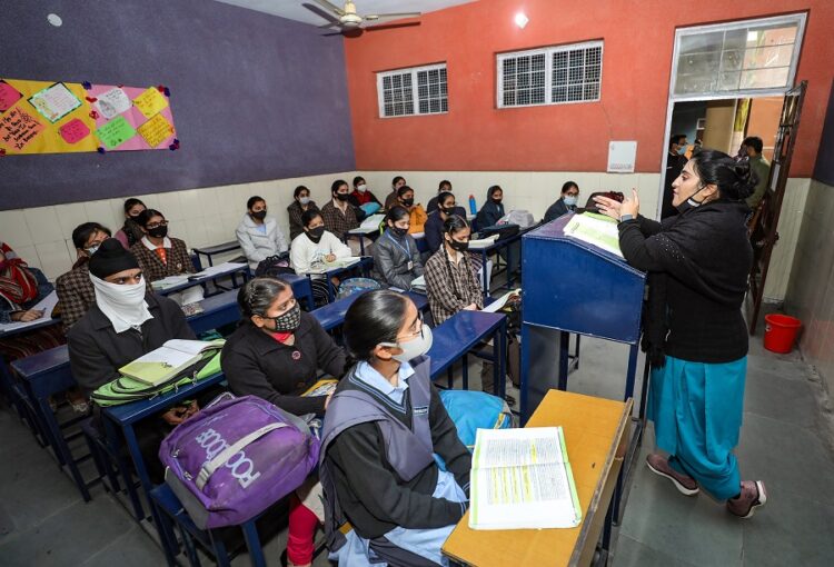Jammu: Students wearing masks, attend class at a school, in Jammu, Monday, Feb. 14, 2022. Authorities allowed all educational institutions from IX standard to university level to reopen. (PTI Photo)(PTI02_14_2022_000136B)